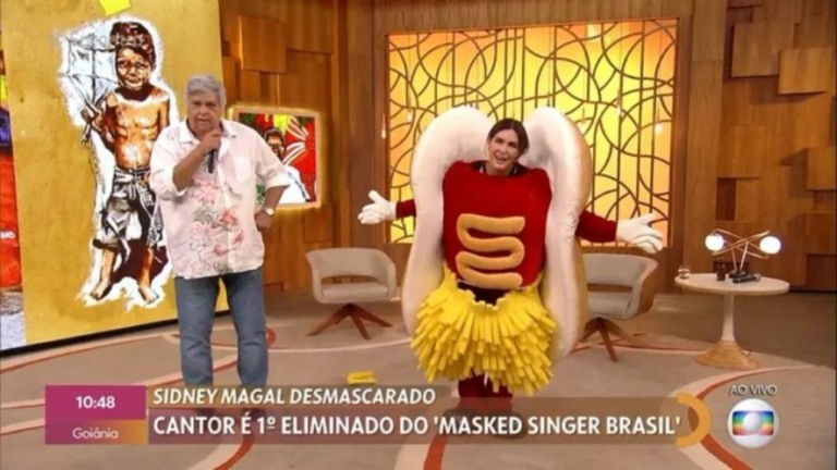Fátima Bernardes recebe Sidney Magal vestida de 'dogão' do 'The Masked Singer'
