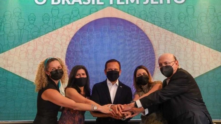 "Acreditamos numa economia liberal", diz Doria em evento com Meirelles