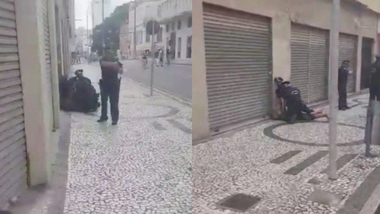 Guarda aponta arma para pessoas que filmaram agressão a homem negro